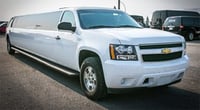 White Chevy Suburban Limousine