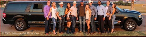 Group celebrating Calgary Stampede with black Expedition SUV Limousine