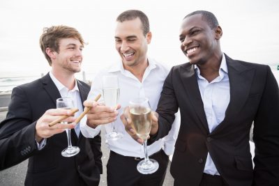 3 men toasting champagne